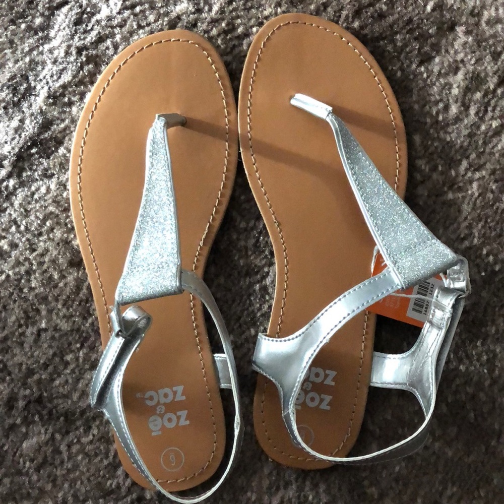 New w/tags. Size 6 womens silver sandals.